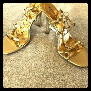 Metallic Gold sandal heels from Guess.